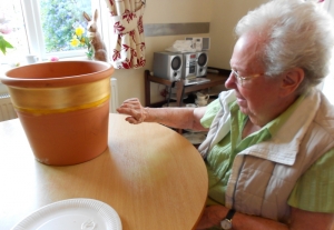 Joan painting Angel's pot