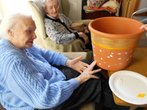 Amy decorating Angela's pot