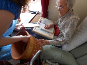 Nellie painting Angela's pot