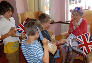 Rosa engages with the children as she sees them with their evacuation boxes