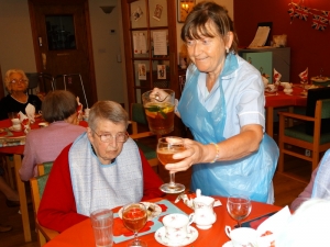 Carol serves some Pimms and lemonade.