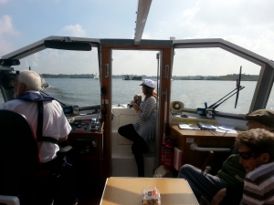 The boat travels across Barton Broad