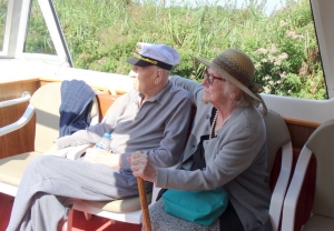 Stella and Frank enjoy the view as they cruise down the river
